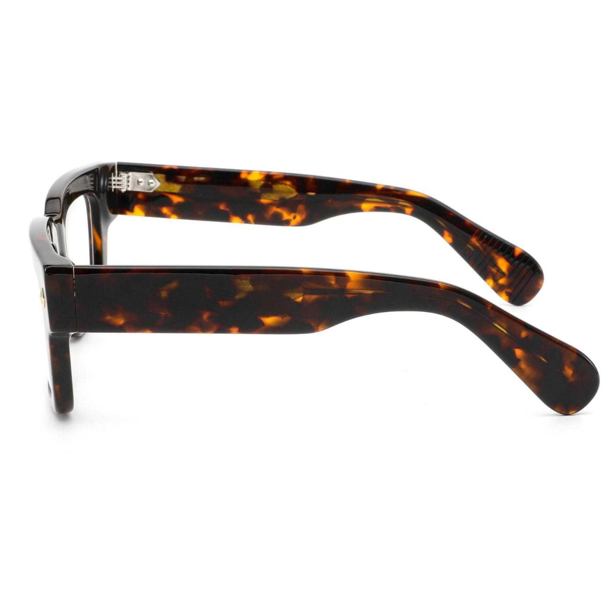 Close-up of ARTISAN Axis dual-tone acetate rectangular eyeglasses showing reinforced hinge design and layered acetate construction