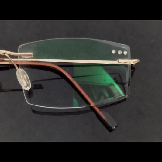 Gold Rimless Executive Glasses with Laser Cut Edges and Left Lens Design