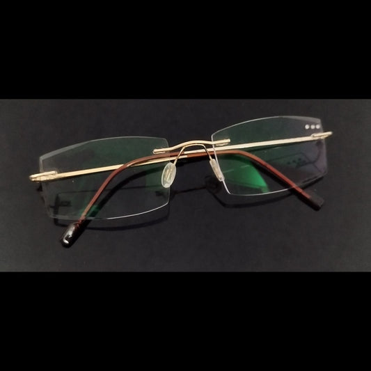 Gold Rimless Executive Glasses with Laser Cut Edges and Left Lens Design