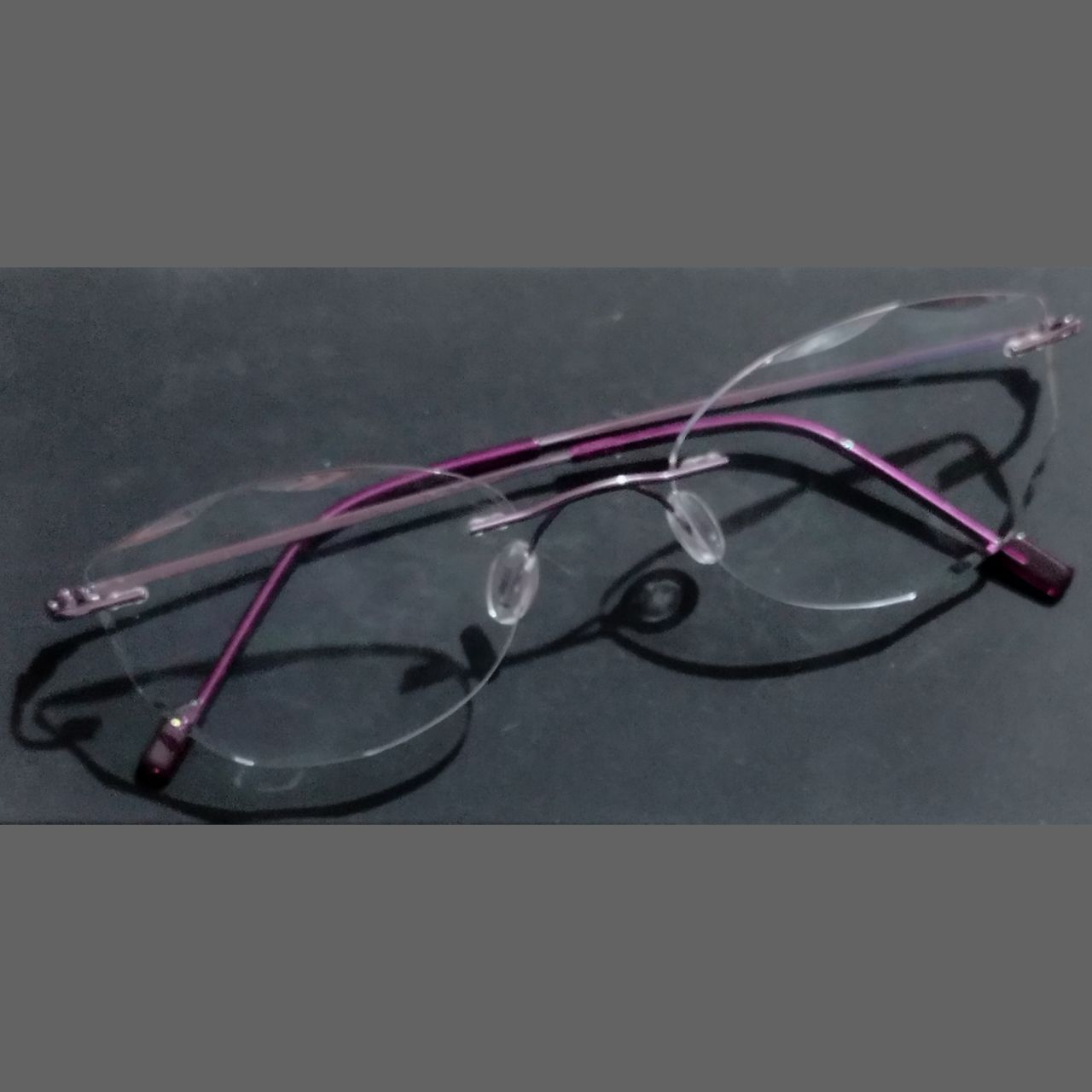 Purple Cat Eye Rimless Glasses with Diamond Cut Edges