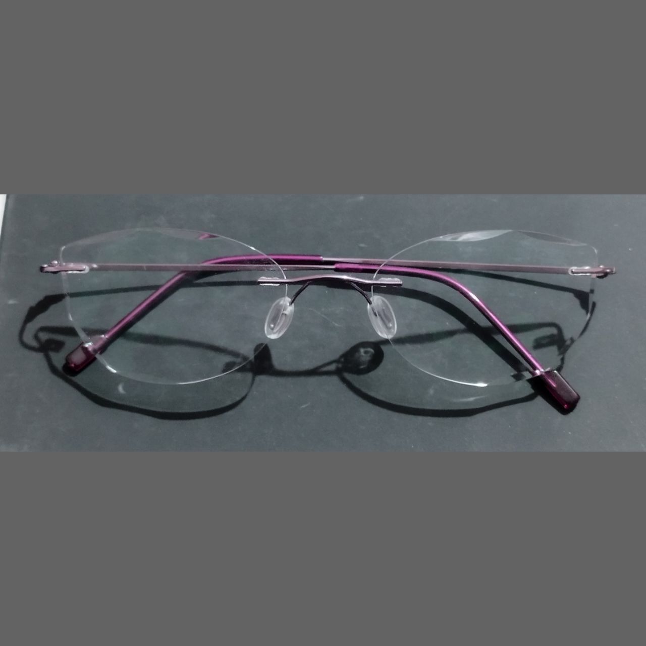 Purple Cat Eye Rimless Glasses with Diamond Cut Edges