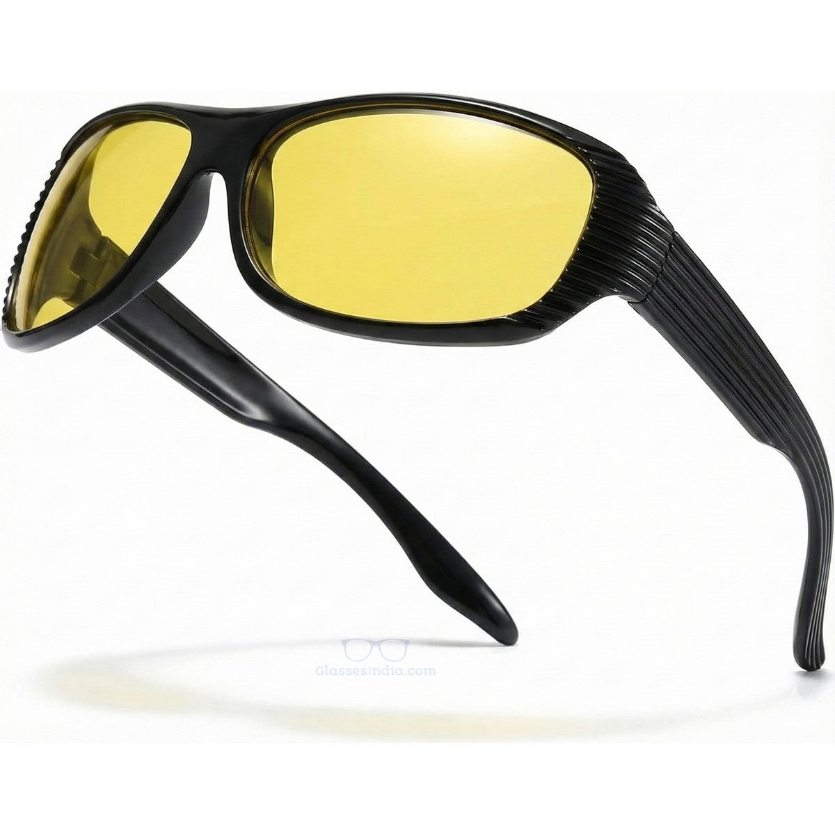Sunglasses with yellow lenses and black frame on a white background