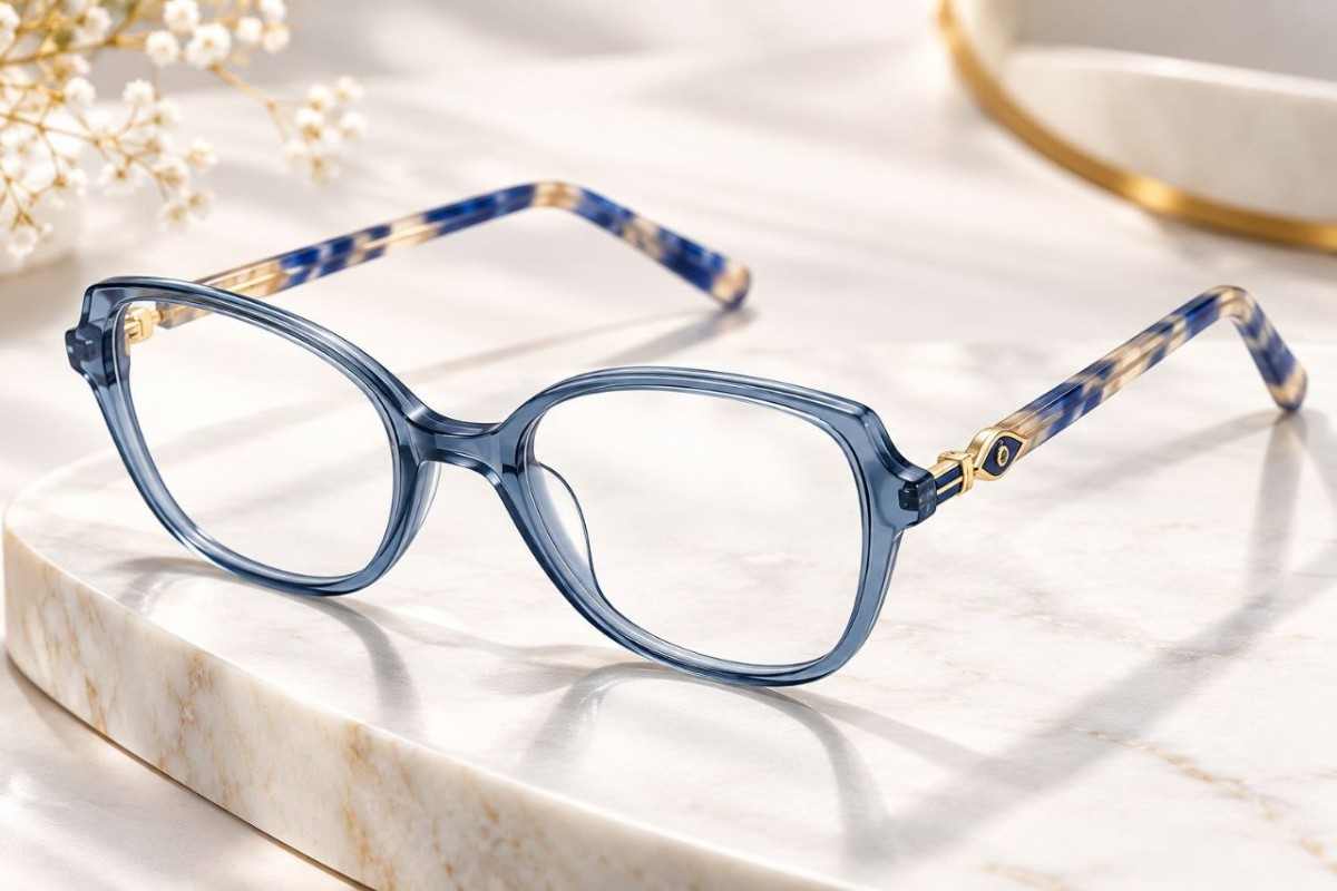 Zoe Miller ZMA 9086 translucent blue grey cat eye acetate glasses on cream marble